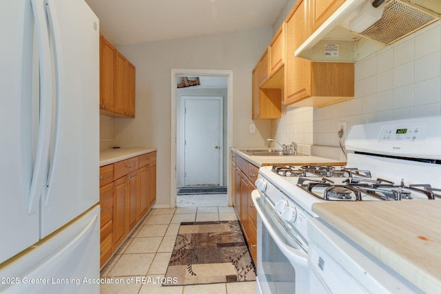 6394 Stephen, Brighton, MI 48116 - kitchen featuring white appliances, under cabinet range hood, a sink, and light countertops