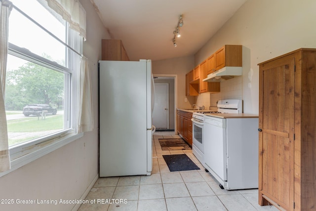6394 Stephen, Brighton, MI 48116 - kitchen featuring white appliances, under cabinet range hood, decorative backsplash, a sink, and light tile patterned floors