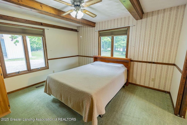 2278 Narrow Lake Rd, Charlotte, MI 48813 - bedroom with beamed ceiling, carpet flooring, wallpapered walls, and baseboards