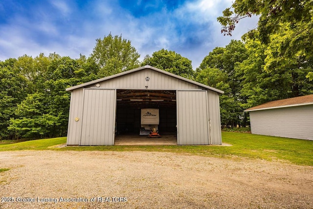 2278 Narrow Lake Rd, Charlotte, MI 48813 - view of pole building with a lawn