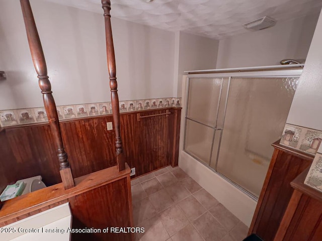 2278 Narrow Lake Rd, Charlotte, MI 48813 - bathroom featuring combined bath / shower with glass door and tile patterned flooring