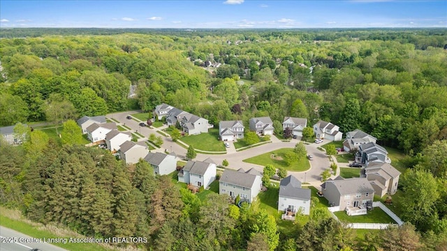 4026 Watts Ln, Lansing, MI 48911 - aerial overview of property's location with a forest and nearby suburban area