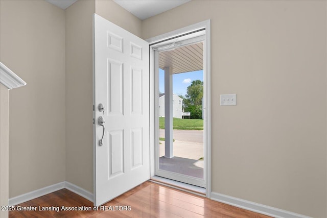 4026 Watts Ln, Lansing, MI 48911 - foyer entrance featuring wood finished floors and baseboards