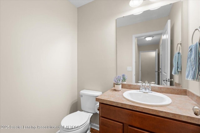 4026 Watts Ln, Lansing, MI 48911 - half bathroom with vanity and toilet