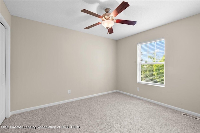4026 Watts Ln, Lansing, MI 48911 - carpeted empty room featuring a ceiling fan and baseboards