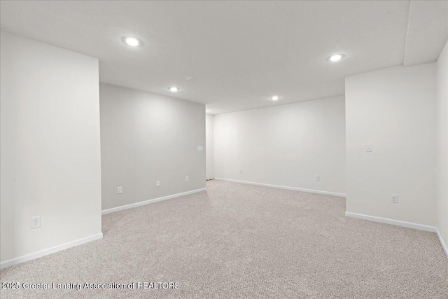 4026 Watts Ln, Lansing, MI 48911 - empty room featuring recessed lighting, light carpet, and baseboards