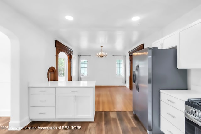 414 W St, Lansing, MI 48915 - kitchen with a chandelier, white cabinets, light countertops, healthy amount of natural light, and recessed lighting