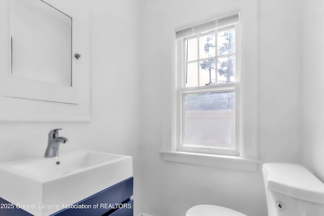 414 W St, Lansing, MI 48915 - bathroom featuring toilet and vanity