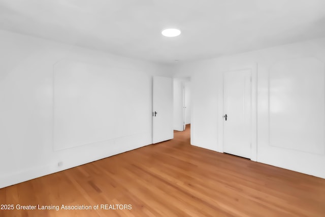414 W St, Lansing, MI 48915 - unfurnished bedroom with wood finished floors
