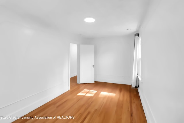 414 W St, Lansing, MI 48915 - empty room with wood finished floors and baseboards