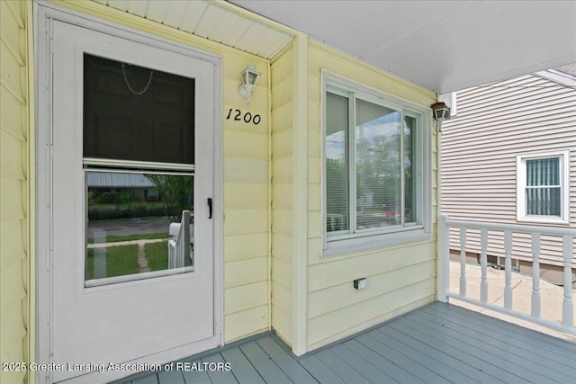 1200 W Rundle Ave, Lansing, MI 48910 - doorway to property featuring a porch