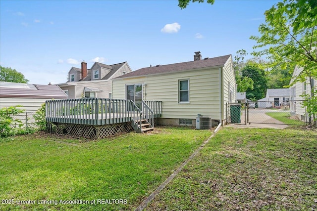 1200 W Rundle Ave, Lansing, MI 48910 - back of house with a gate, a wooden deck, a chimney, and central AC