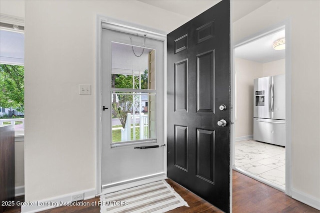 1200 W Rundle Ave, Lansing, MI 48910 - entrance foyer featuring healthy amount of natural light, marble finish flooring, and baseboards