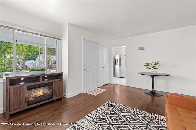 1200 W Rundle Ave, Lansing, MI 48910 - foyer entrance featuring dark wood finished floors and baseboards