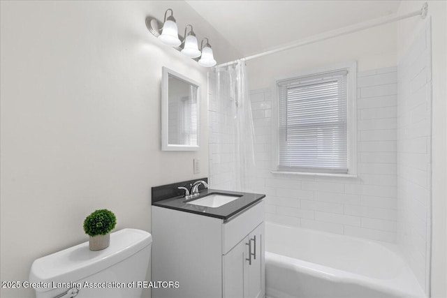 1200 W Rundle Ave, Lansing, MI 48910 - bathroom featuring toilet, vanity, and shower / tub combo