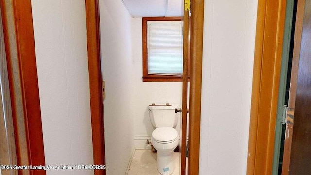 411 W Ionia St, Lansing, MI 48933 - bathroom featuring toilet and baseboards