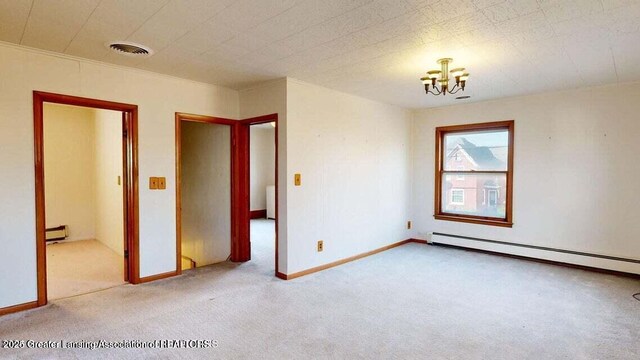 411 W Ionia St, Lansing, MI 48933 - carpeted spare room with a baseboard radiator, a chandelier, and baseboard heating