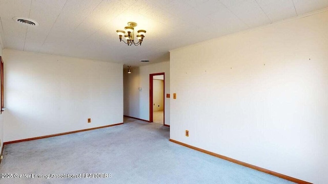 411 W Ionia St, Lansing, MI 48933 - unfurnished room with carpet floors, a chandelier, and baseboards