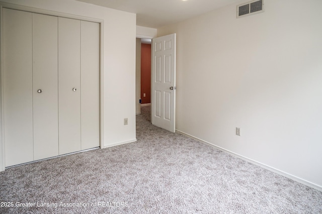 956 Trafalger Ln, East Lansing, MI 48823 - unfurnished bedroom featuring carpet flooring and a closet