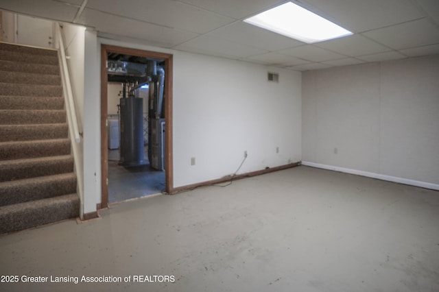 956 Trafalger Ln, East Lansing, MI 48823 - finished basement with stairs, water heater, and a paneled ceiling