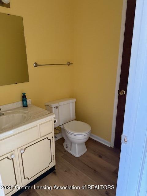 956 Trafalger Ln, East Lansing, MI 48823 - bathroom featuring vanity and wood finished floors