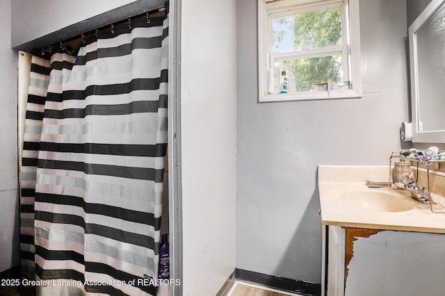 414 S Rosemary St, Lansing, MI 48917 - bathroom with vanity and curtained shower