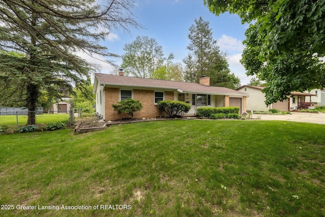 1416 Briarwood Dr, Lansing, MI 48917 - view of front facade featuring an attached garage, brick siding, concrete driveway, and a chimney