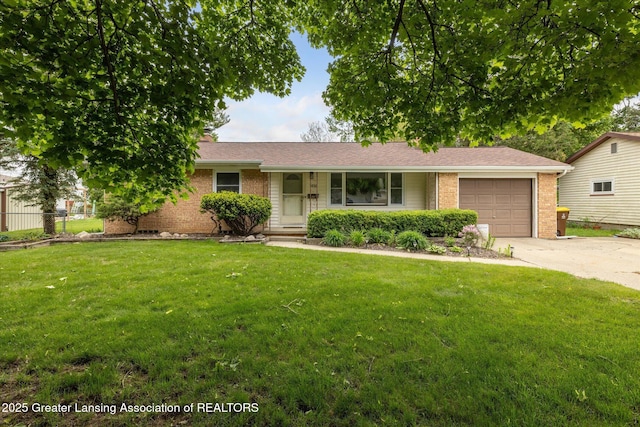 1416 Briarwood Dr, Lansing, MI 48917 - ranch-style home featuring brick siding, driveway, a garage, and a front yard