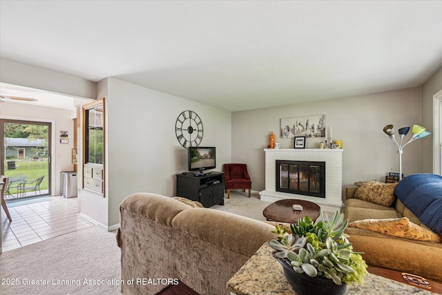 1416 Briarwood Dr, Lansing, MI 48917 - living area with light carpet, a fireplace, baseboards, and light tile patterned floors