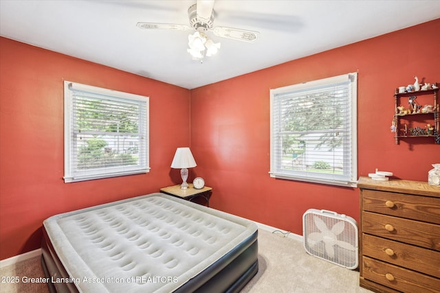 1416 Briarwood Dr, Lansing, MI 48917 - carpeted bedroom with baseboards and ceiling fan