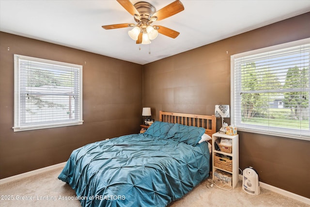 1416 Briarwood Dr, Lansing, MI 48917 - carpeted bedroom with baseboards and ceiling fan