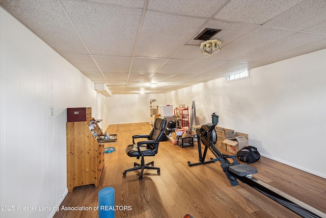 1416 Briarwood Dr, Lansing, MI 48917 - exercise area featuring wood finished floors and a paneled ceiling