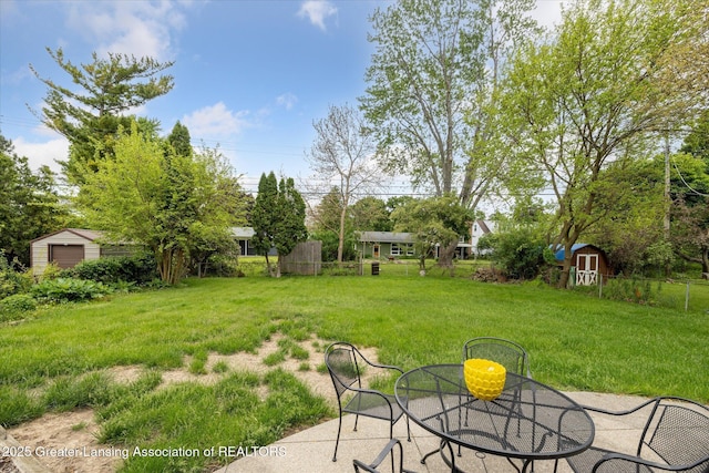 1416 Briarwood Dr, Lansing, MI 48917 - view of grassy yard featuring a patio