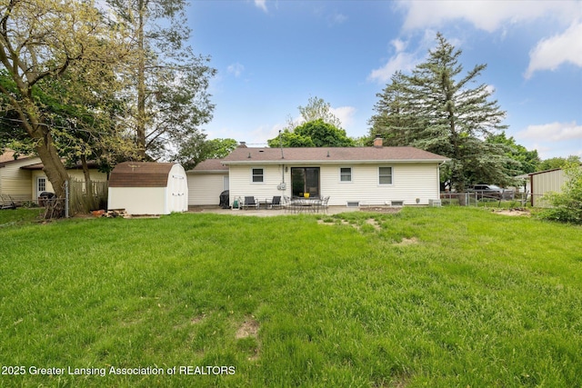 1416 Briarwood Dr, Lansing, MI 48917 - back of property featuring a patio area and a chimney