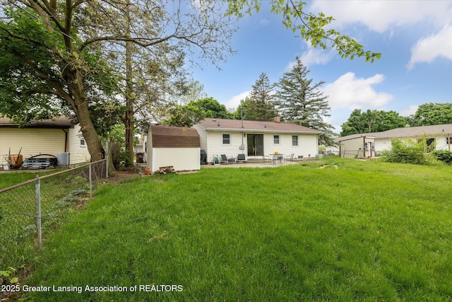 1416 Briarwood Dr, Lansing, MI 48917 - back of house featuring a patio and a chimney