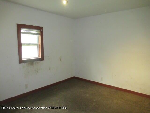 2071 Vandekarr Rd, Owosso, MI 48867 - unfurnished room featuring carpet flooring and baseboards