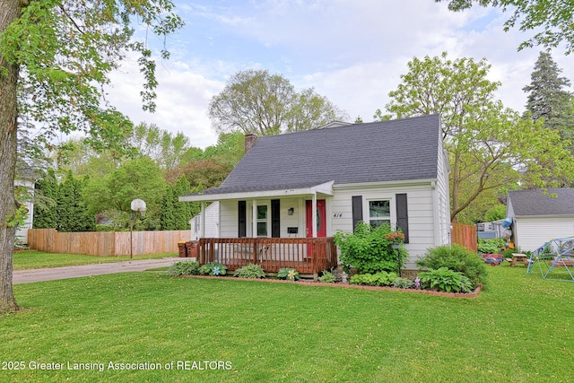 414 Vessey St, Portland, MI 48875 - cape cod-style house featuring a porch, a chimney, and roof with shingles