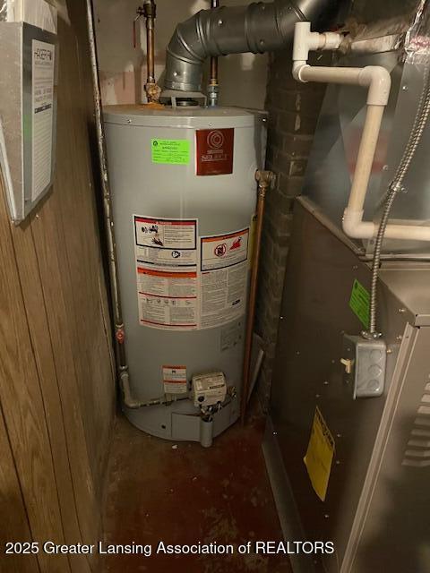 2303 Devonshire Ave, Lansing, MI 48910 - utility room featuring water heater and heating unit