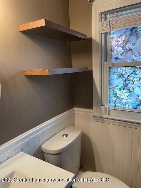 2303 Devonshire Ave, Lansing, MI 48910 - half bath with toilet and a wainscoted wall