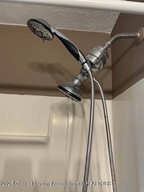 2303 Devonshire Ave, Lansing, MI 48910 - bathroom view of a shower with curtain