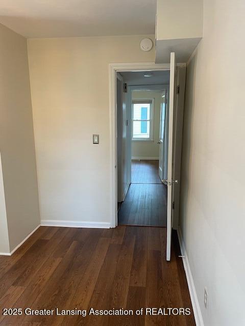 2303 Devonshire Ave, Lansing, MI 48910 - corridor featuring dark wood-style flooring and baseboards