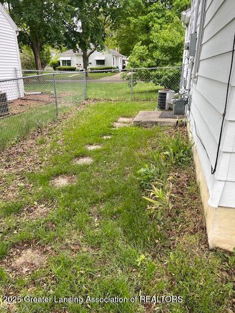 2303 Devonshire Ave, Lansing, MI 48910 - view of yard with central AC unit