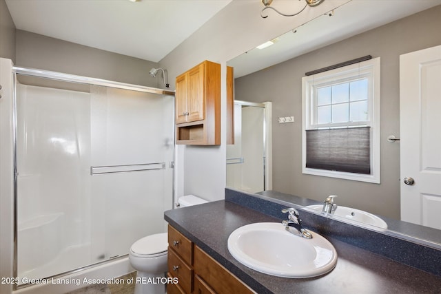 3893 E Plover Pl, East Lansing, MI 48823 - full bath featuring a stall shower, toilet, and vanity