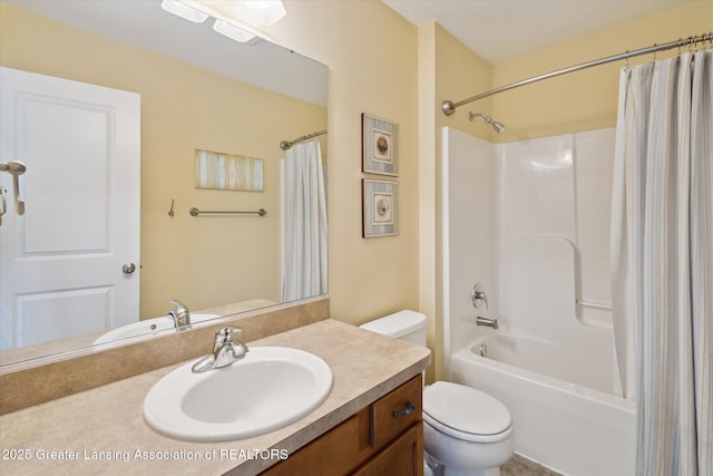 3893 E Plover Pl, East Lansing, MI 48823 - bathroom featuring vanity, toilet, and shower / bathtub combination with curtain