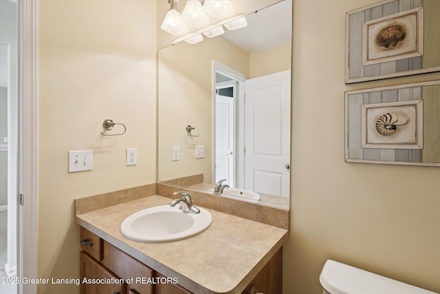 3893 E Plover Pl, East Lansing, MI 48823 - bathroom featuring vanity and toilet