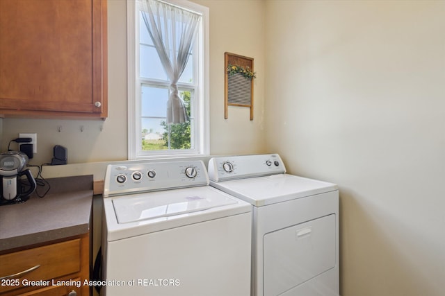 3893 E Plover Pl, East Lansing, MI 48823 - laundry room with cabinet space and washer and dryer