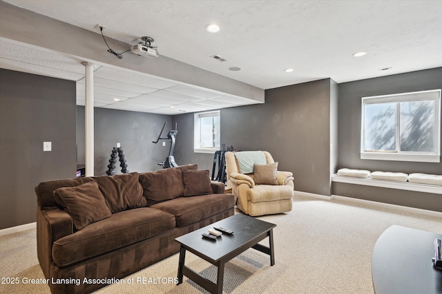 3893 E Plover Pl, East Lansing, MI 48823 - living area featuring light carpet, baseboards, and recessed lighting