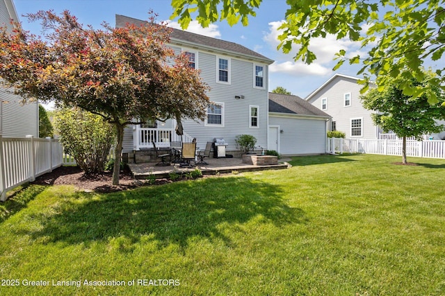 3893 E Plover Pl, East Lansing, MI 48823 - back of property featuring a patio area