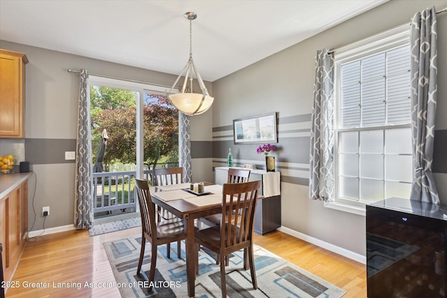 3893 E Plover Pl, East Lansing, MI 48823 - dining area with light wood finished floors and baseboards