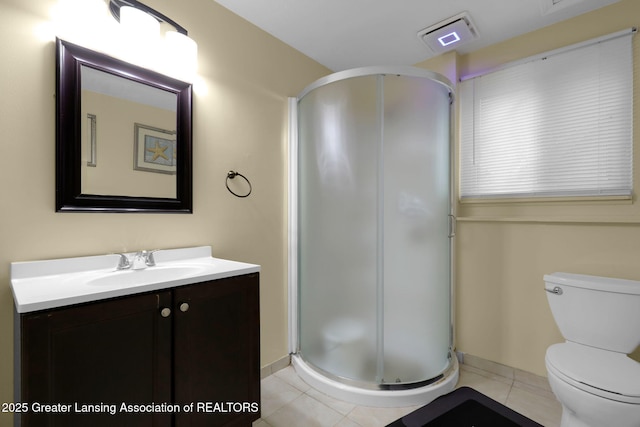 4716 Wainwright Ave, Lansing, MI 48911 - bathroom with a shower stall, vanity, toilet, and tile patterned floors